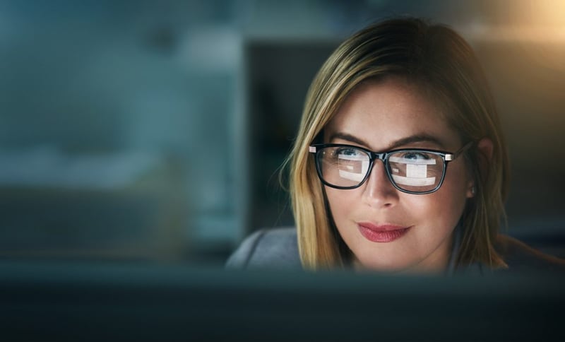 businesswoman looking at her computer screen
