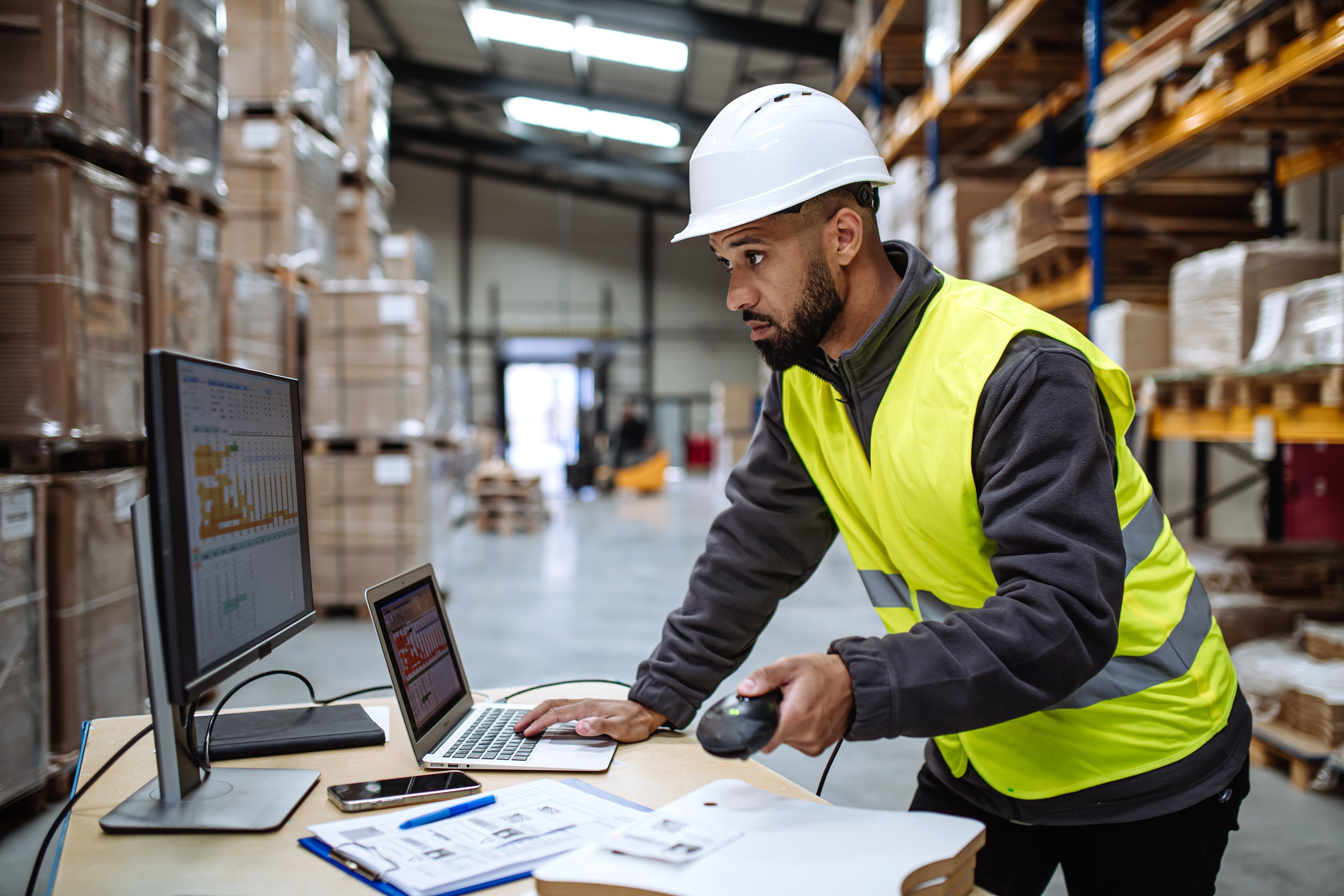 Guy using software (photo used in tradeshow ad)